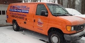 Water Damage and Mold Removal Van At Residential Job Site